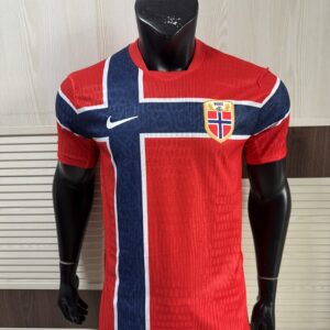 Nike Norway 2026 World Cup Home Jersey front view showing striking Chile red official Norwegian shirt with flag-inspired cross design and Nike Aero-FIT fabric texture